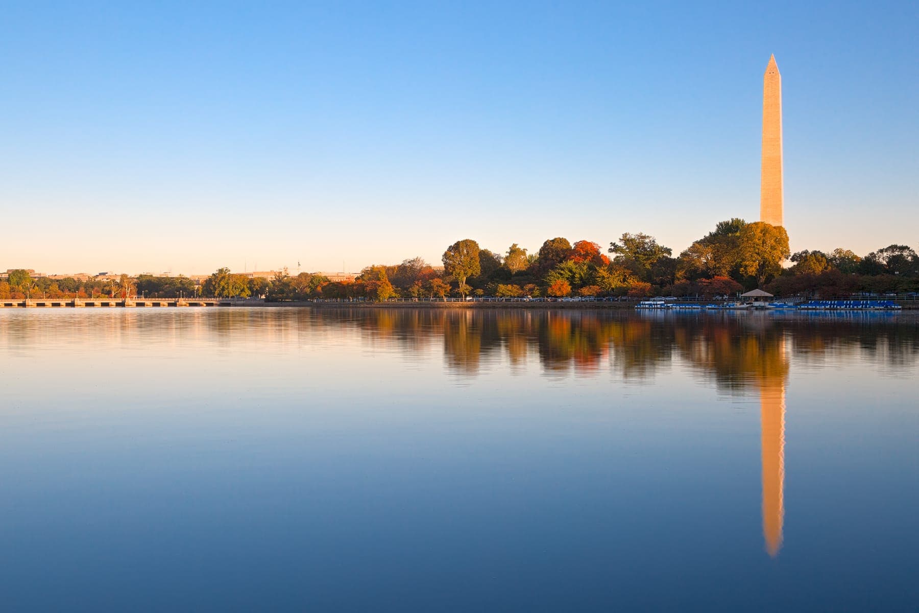 Sunrise over the Tidal Basin with the Washington Monument reflected in still water
